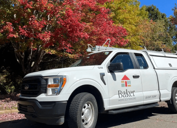 Baker Home Exteriors service van parked outside a Greensboro home