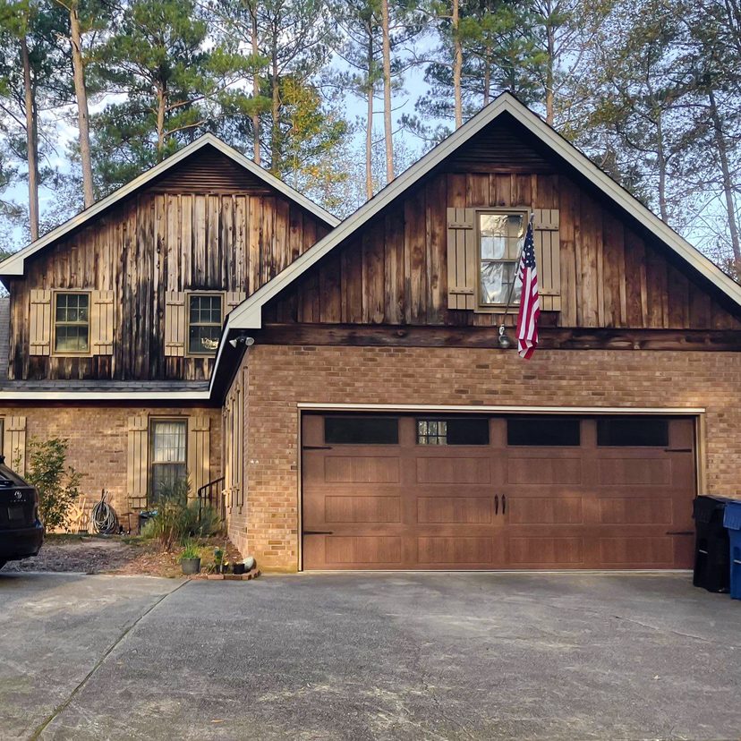 Before: weathered stained wood siding on the gables above a brick garage