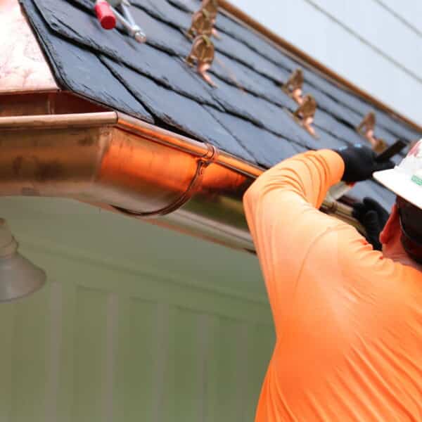 Copper gutter installation on a home