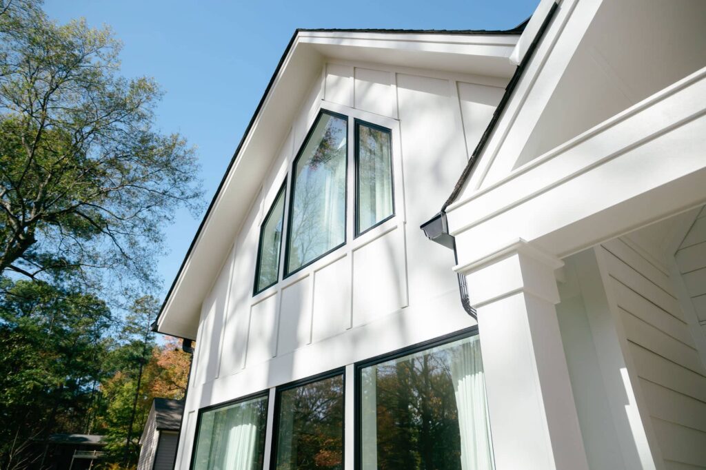 White siding with new black windows