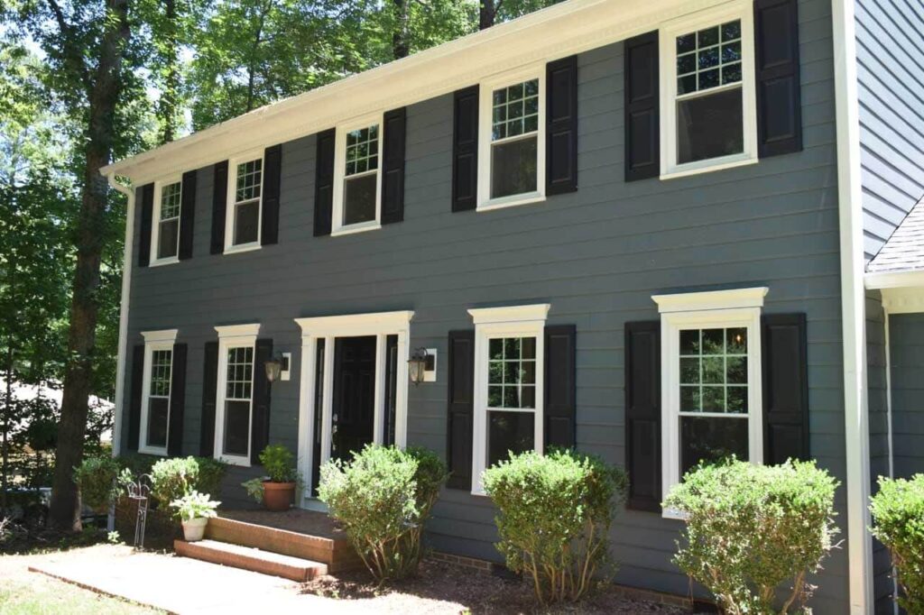 New grey siding installation on family home