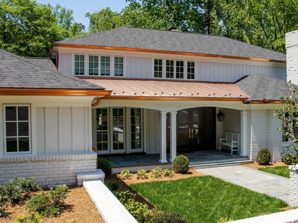 European copper gutters on brick and siding home