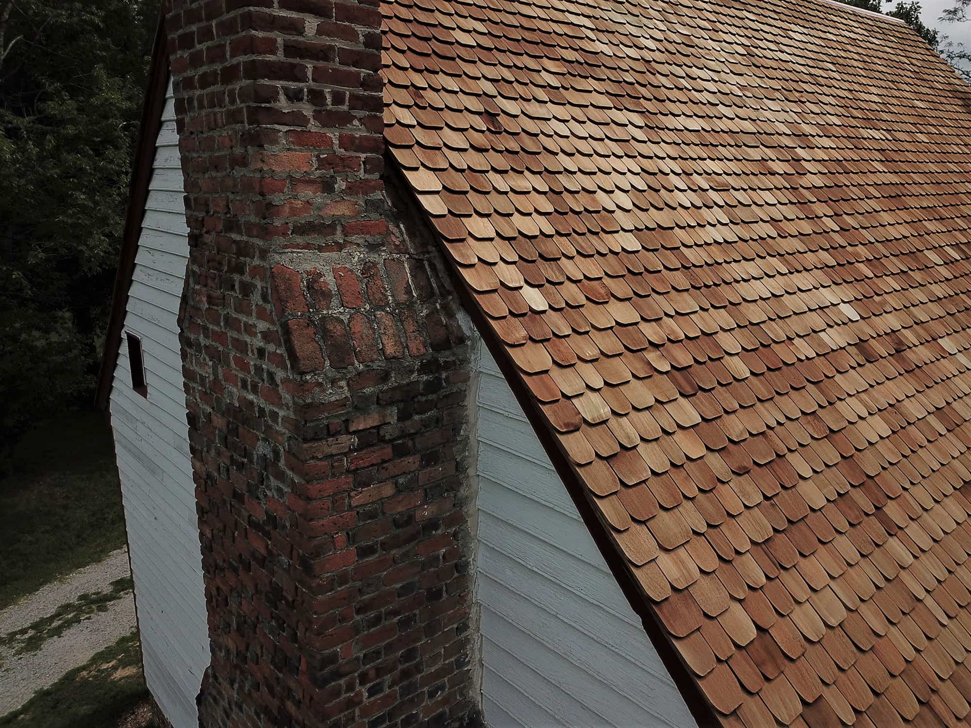 Cedar roofing shingles on steep sloped roof