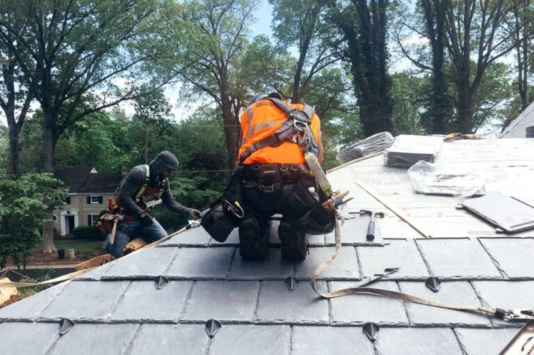 Roofer installing slate roof