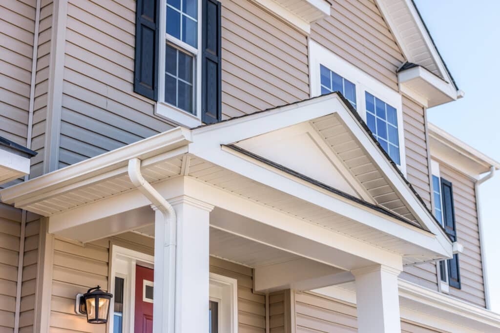 Tan siding replacement; example of best home improvement return on investment