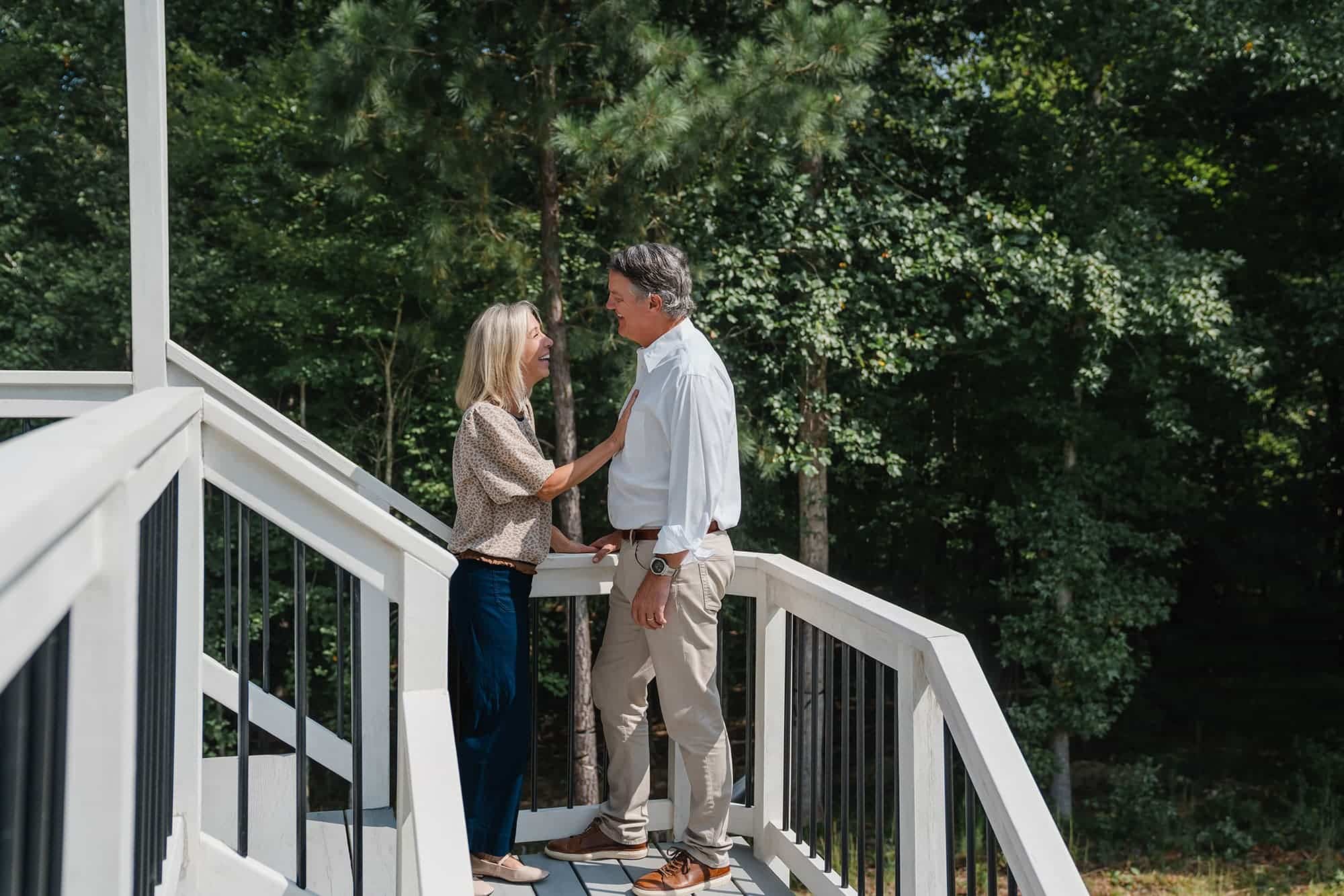 Decorative image of couple standing on deck