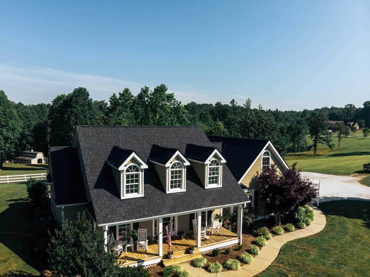 New shingle roof and yellow siding on home in Asheville mountains