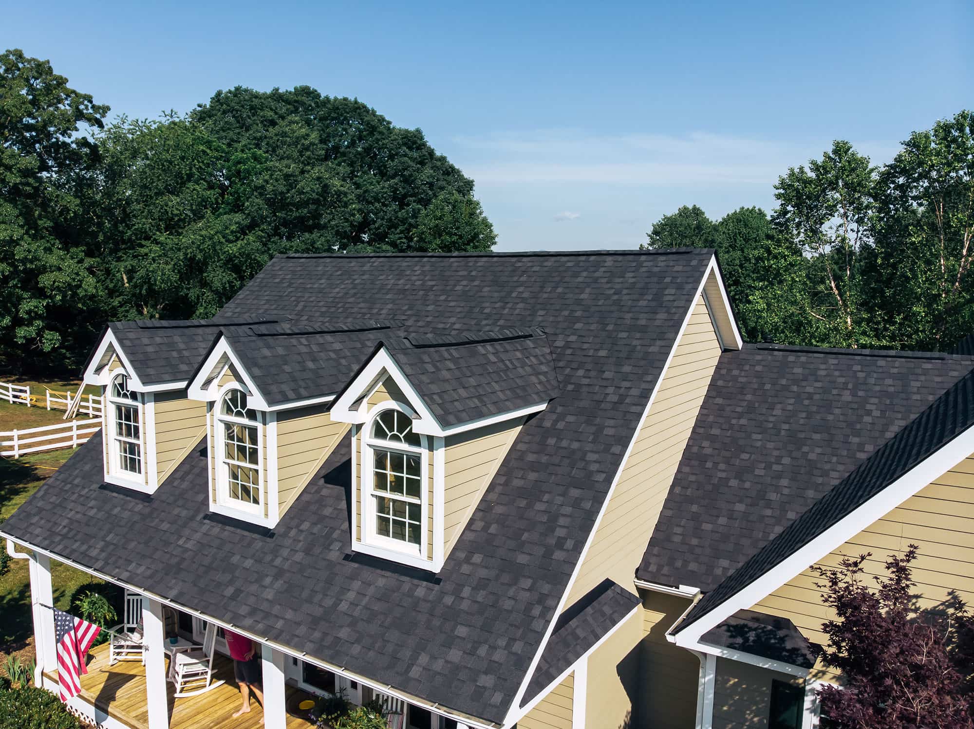 Black asphalt shingle roof on mountain home