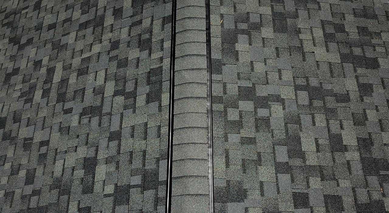 Residential roof with attic ventilation