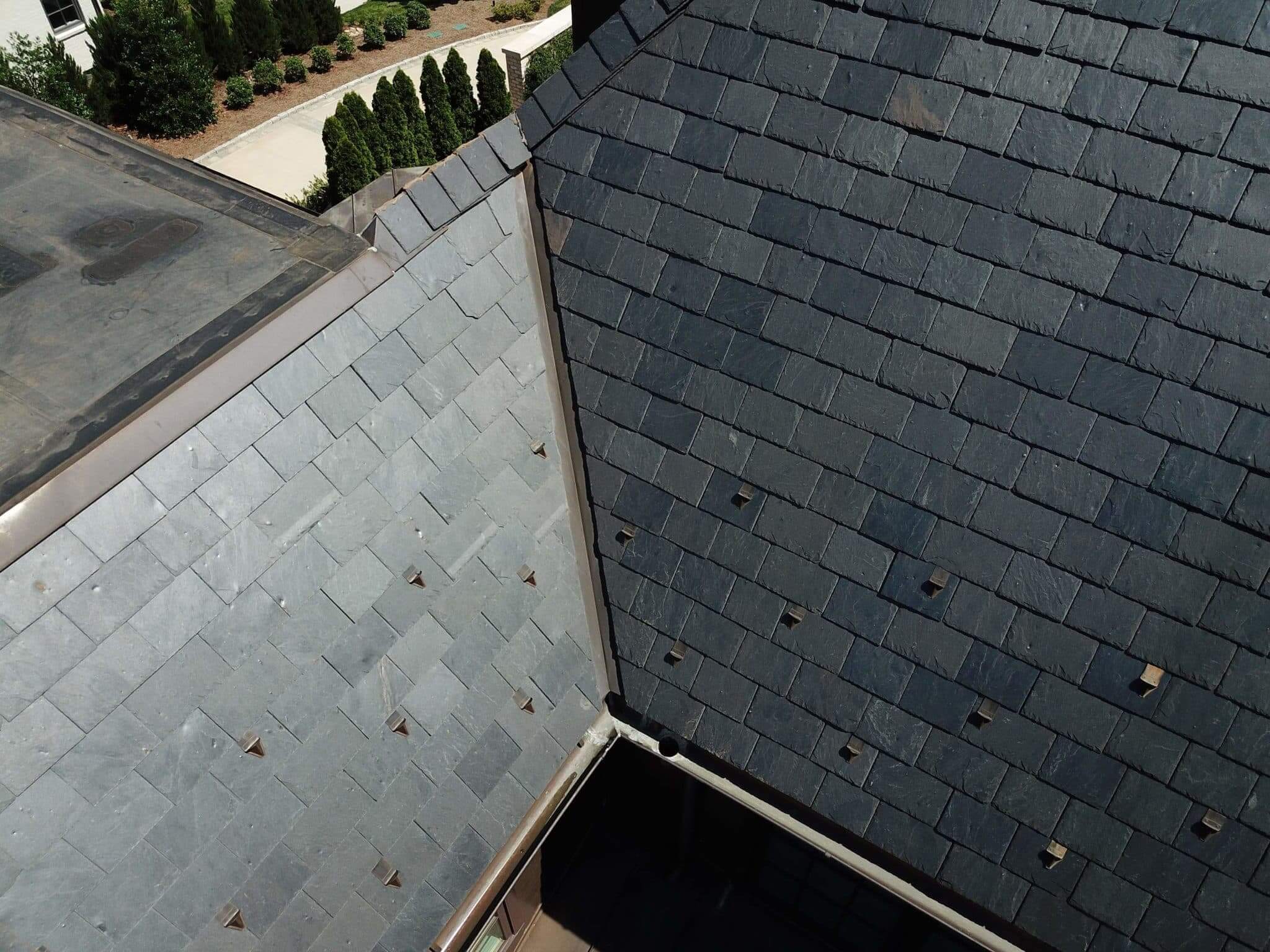 Black slate roof on a stone home