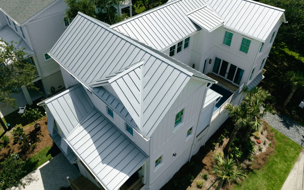 Standing-seam metal roofs on a white Isle of Palms beach house