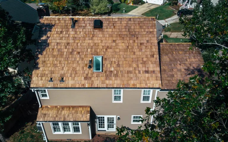 Aerial view of a new cedar shake roof installed by Baker in Greensboro