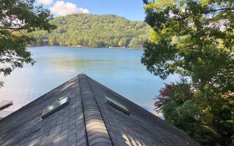 New shingle roof with skylights overlooking a Blue Ridge mountain lake