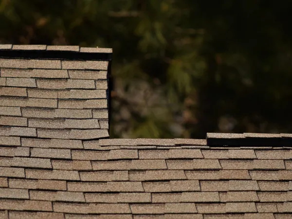 Atlas Pinnacle Pristine Tan shingles on a completed roof replacement