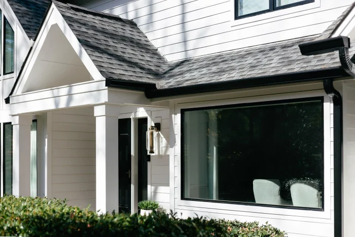 Modern Monochromatic exterior by Baker Home Exteriors