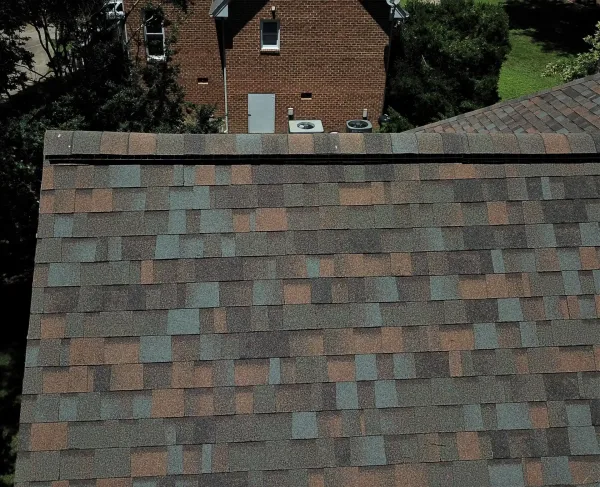Owens Corning Duration Aged Copper shingles on a roof replacement by Baker Home Exteriors