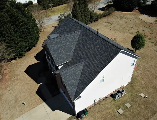Owens Corning Duration Black Sable shingles on a roof replacement by Baker Home Exteriors