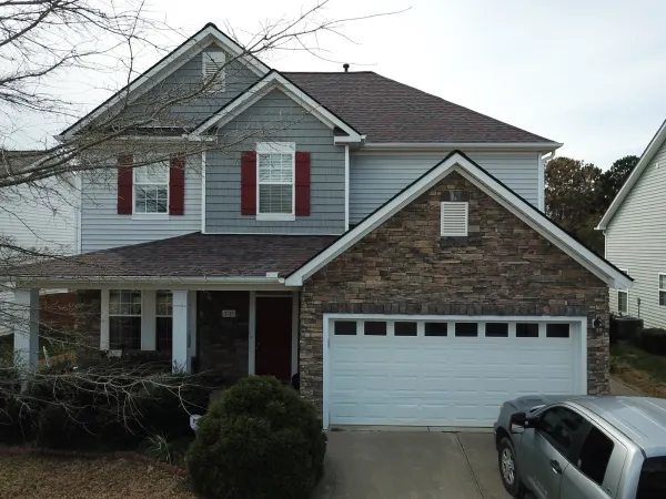 Owens Corning Duration Merlot shingles on a roof replacement by Baker Home Exteriors