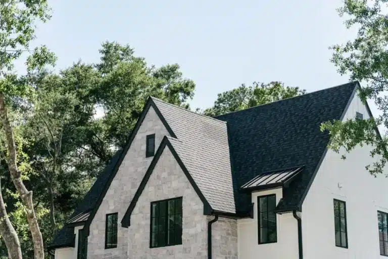 new steep black roof on grey stone house in Raleigh NC