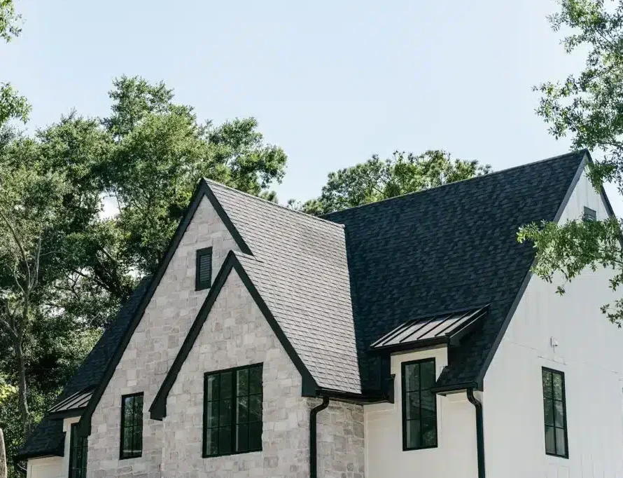 new steep black roof on grey stone home in Raleigh NC