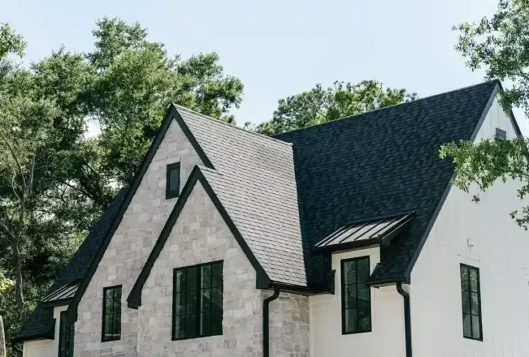 new steep black roof on grey stone home in Raleigh NC