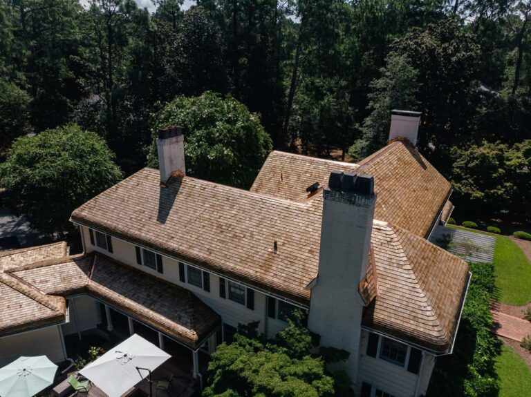 Aerial view of a new cedar shake roof with copper details