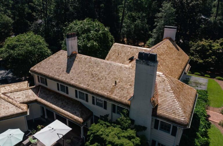 Aerial view of a new cedar shake roof with copper details