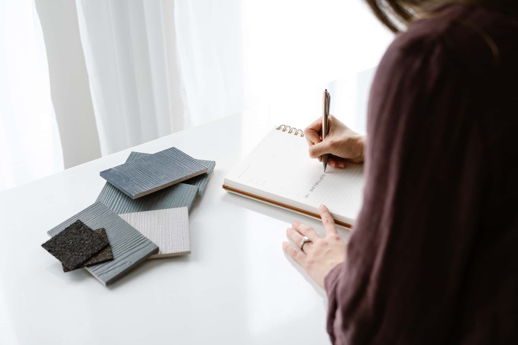 Decorative image of woman writing in a notebook