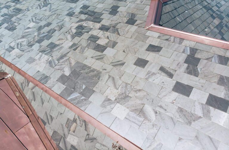 Gray and Blue slate roof with copper details