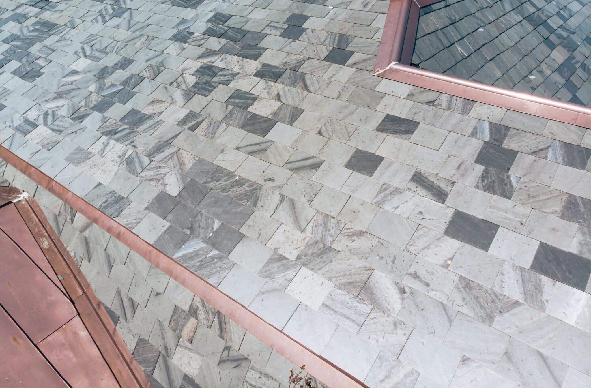 Gray and Blue slate roof with copper details
