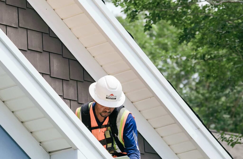 Roofer installing aluminium drip edge