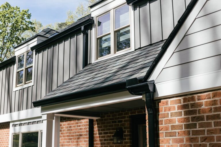 Black gutters at corner of home