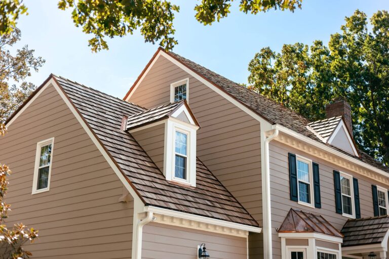 Brown roof with copper accents on family home