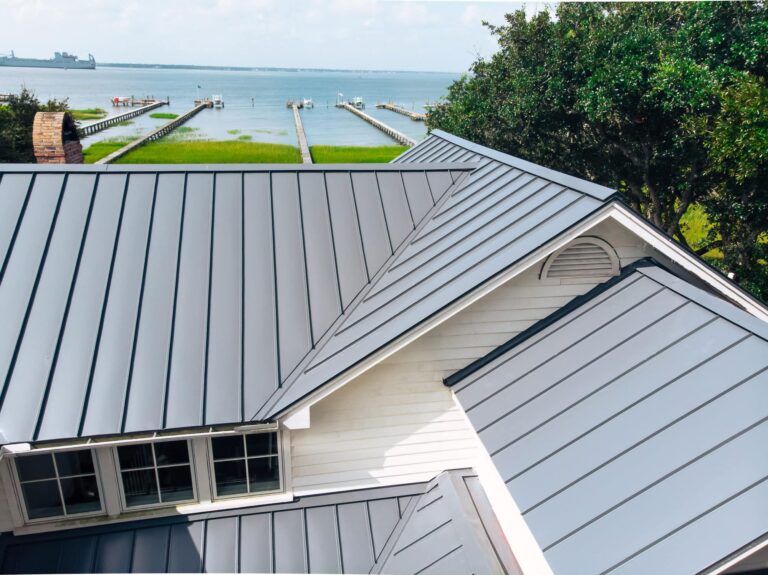 Grey metal roof on coastal home with ocean in background