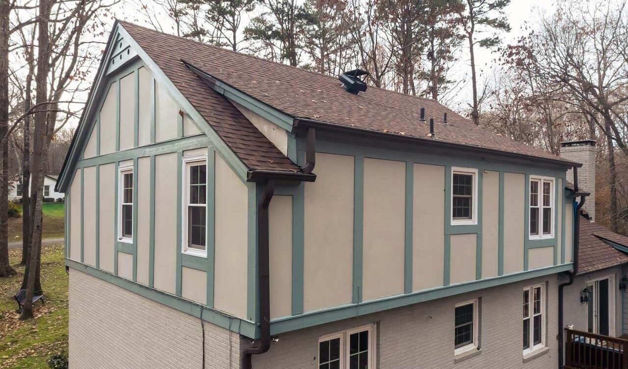 Before image of old siding on home