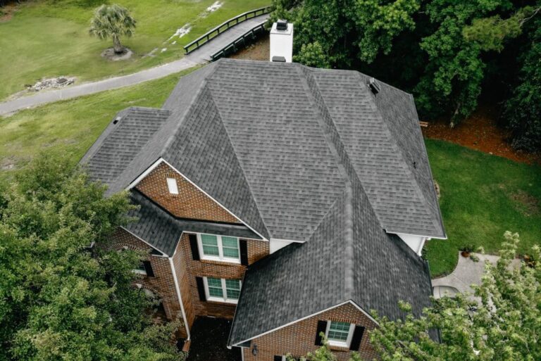Aerial image of a grey shingle roof on brick home