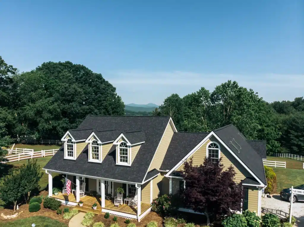 Asphalt shingle roof with solar panels in blue ridge mountain setting