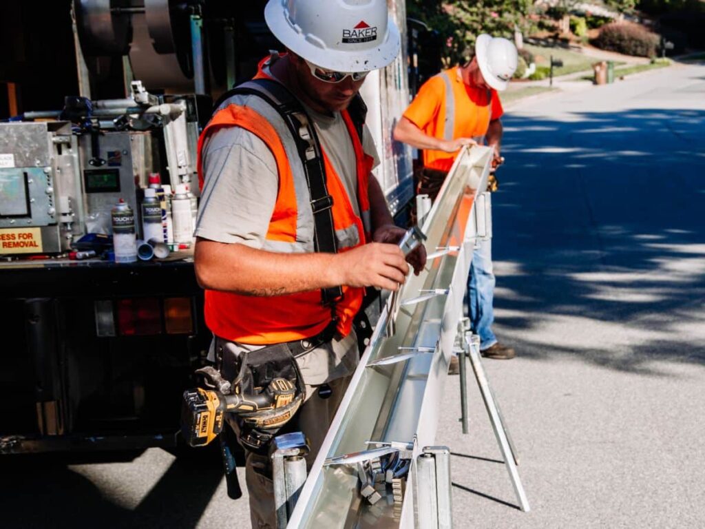Team cuts customer gutters by truck