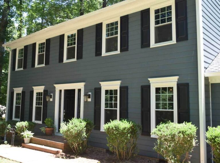 New grey siding installation on family home