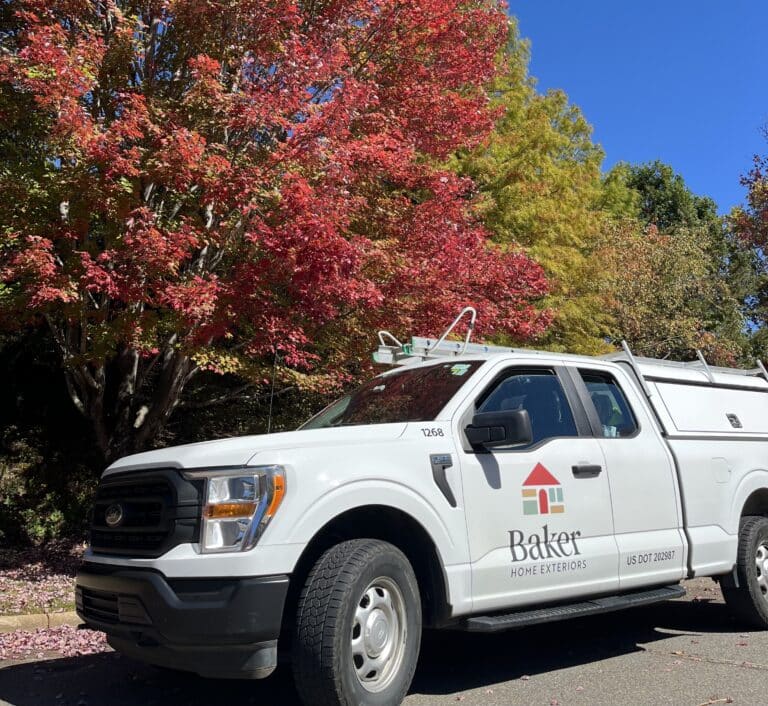 Baker Home Exteriors truck by Asheville leaves