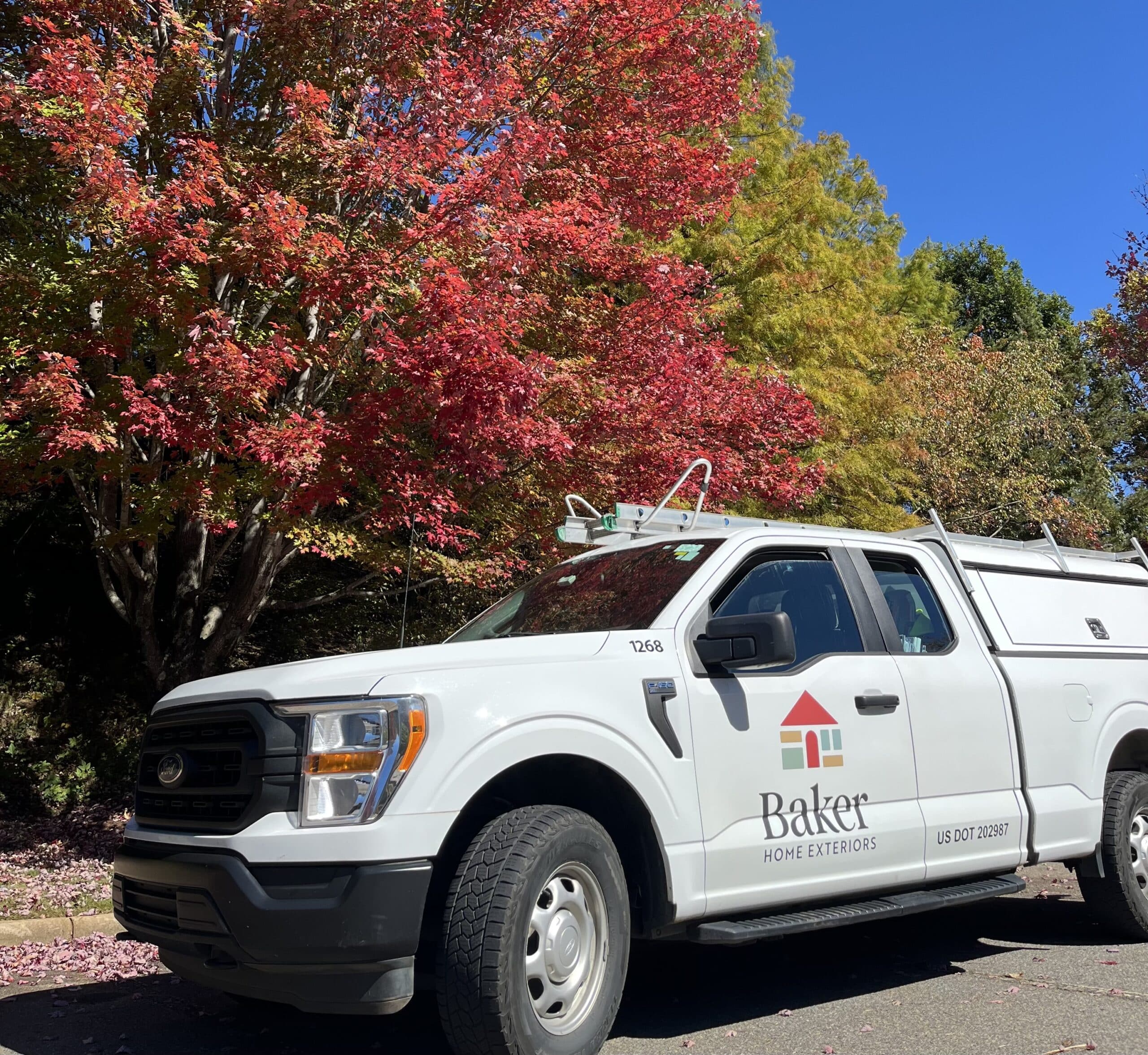 Baker Home Exteriors truck by Asheville leaves
